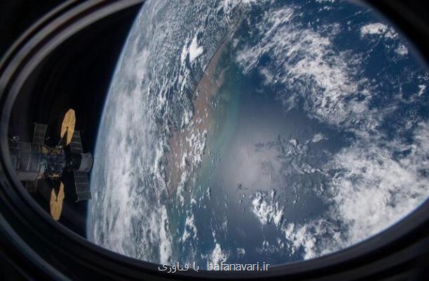 تصویر ایستگاه فضایی بین المللی بر فراز اقیانوس